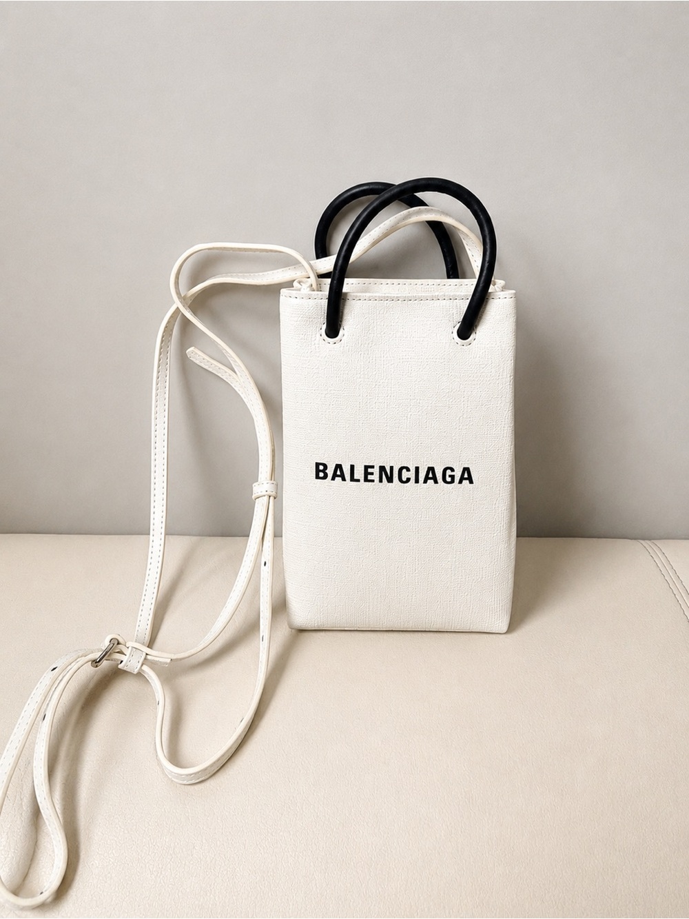 White Mini Tote with Black Top Handles. Crossbody strap.